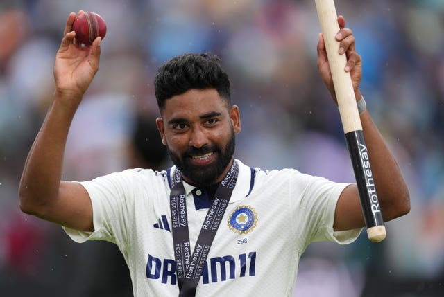 Mohammed Siraj celebrates with the match ball and a stump after India's win