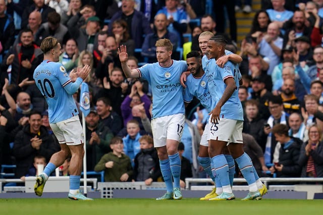 Erling Haaland, second right, celebrates the opening goal