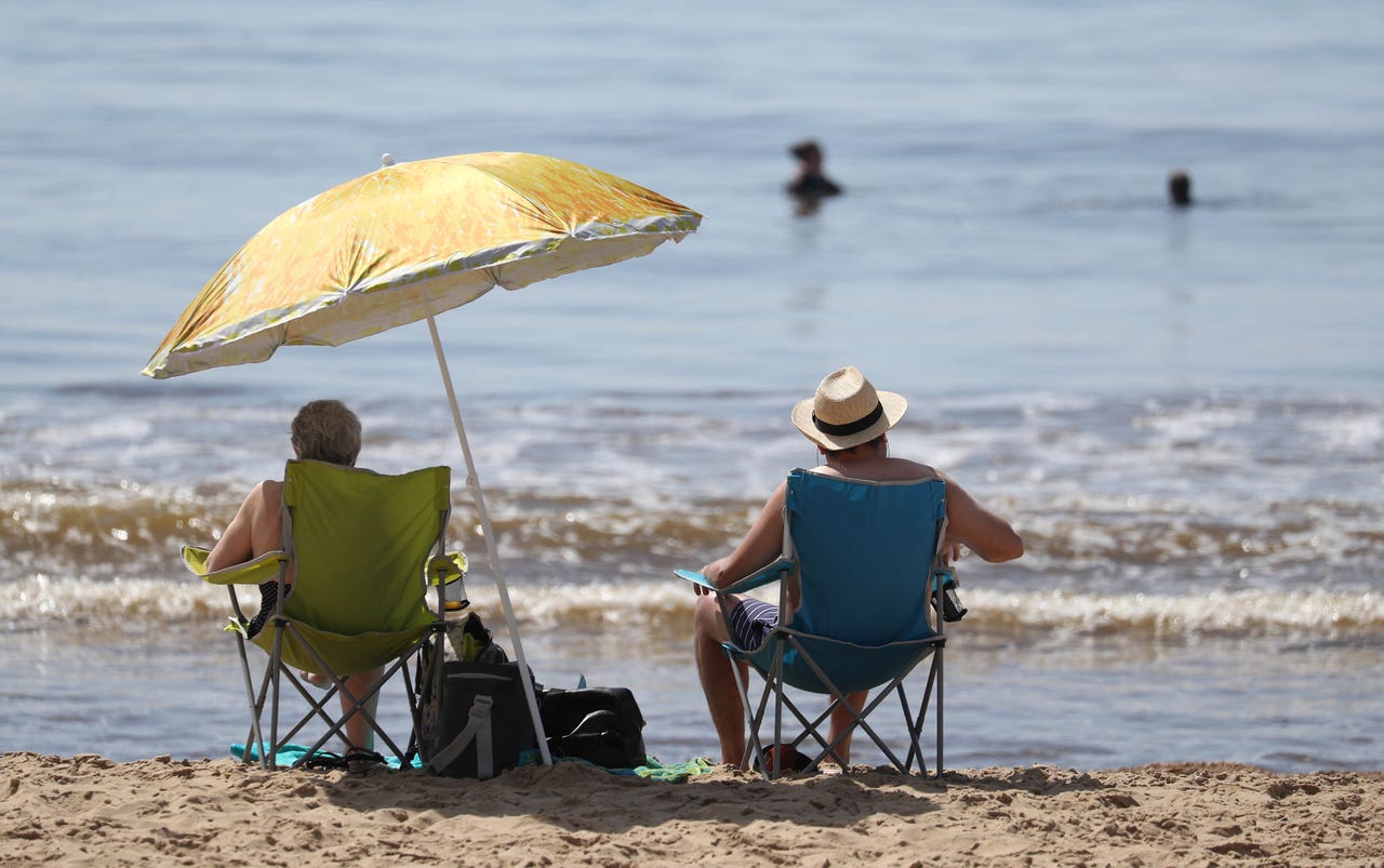 In Pictures: Back To The Beach For Sun-seekers As Temperatures Rise 