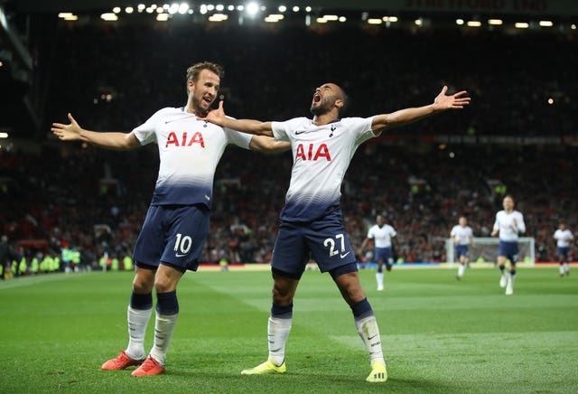 Kane celebrates Spurs' third goal with team-mate Lucas Moura