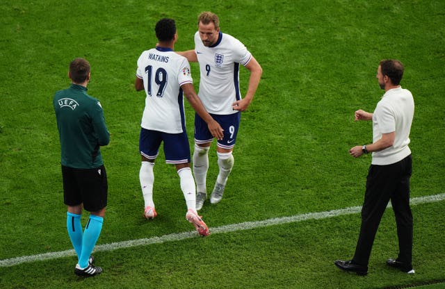 England forward Ollie Watkins embraces Harry Kane as he comes onto the pitch against Denmark