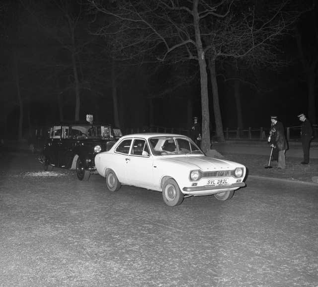 Ian Ball’s Ford Escort, and the royal car close behind