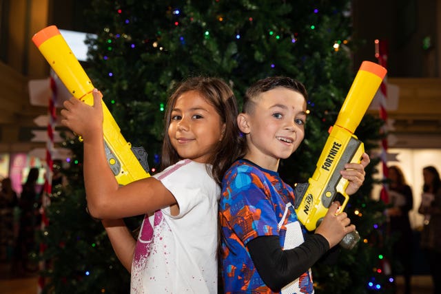 Ayva Eiman, seven ,and Josh Wilcock, eight, play with a Nerf Elite Fortnite SP-L Hasbro toy