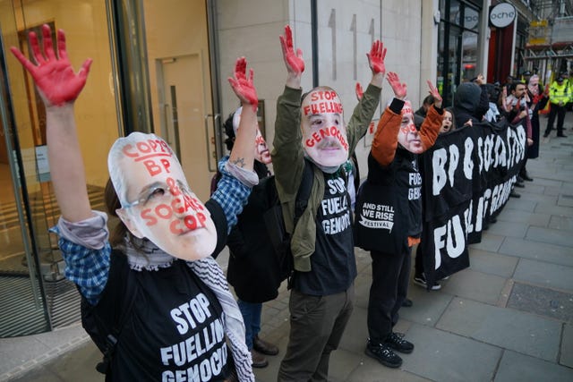 Protesters during the Climate Justice Coalition’s March stop outside the office of Socar in the Strand, central London