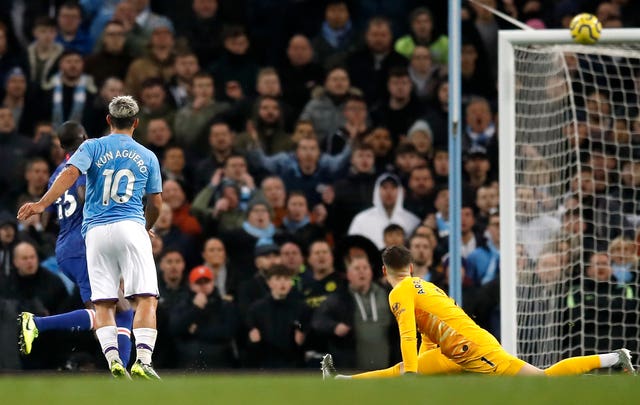 Sergio Aguero, left, sees his shot hit the crossbar
