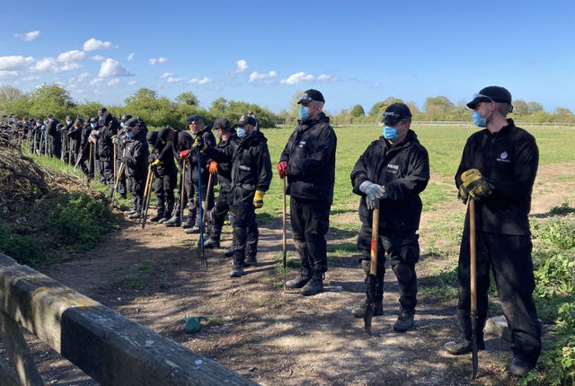 Police officers searching a field off Ratling Road in Aylesham, Kent as part of the huge investigation into Mrs James' death