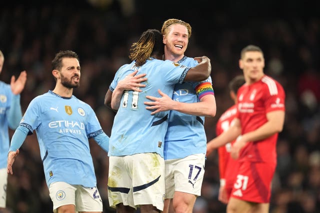 Manchester City’s Kevin De Bruyne is hugged by Jeremy Doku as he celebrates scoring against Nottingham Forest