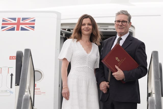 Prime Minister Sir Keir Starmer and his wife Victoria boarding a plane