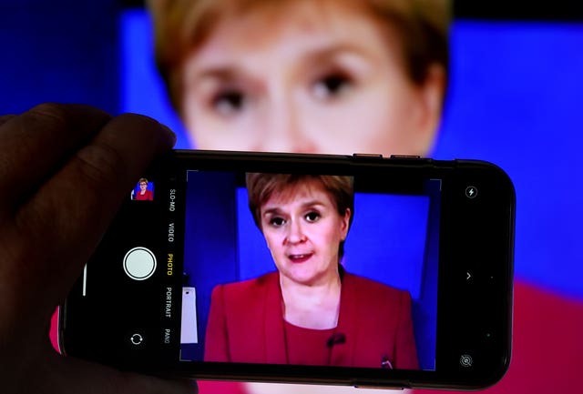 Nicola Sturgeon on a phone 