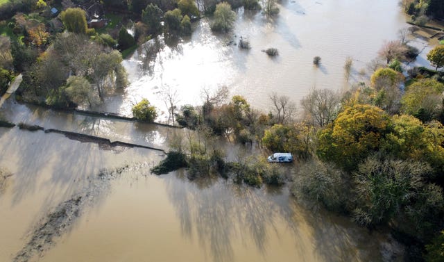 A van stranded in the floodwaters of the River Adur near Shermanbury in West Sussex