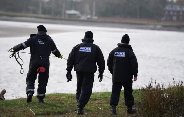 Police search teams on the banks of the River Wyre in Hambleton