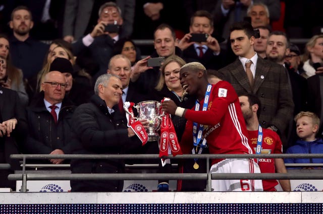 Mourinho and Paul Pogba with the trophy after the EFL Cup Final at Wembley in February 2017