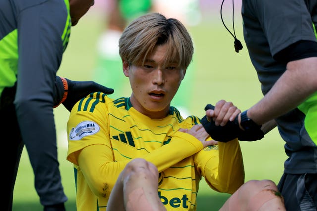 Celtic’s Kyogo Furuhashi receives treatment after picking up a shoulder injury