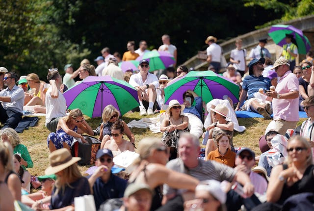 Spectators claimed their places on Henman Hill early