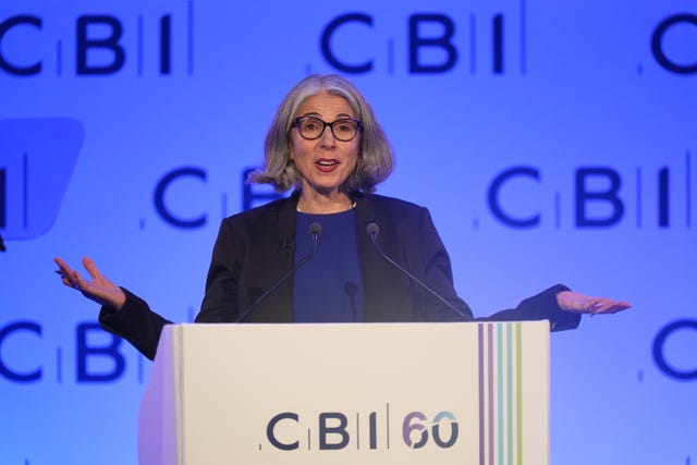 Rain Newton-Smith speaking from a CBI lectern, gesturing with her arms