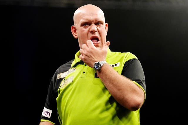 Michael van Gerwen looking worried on stage 