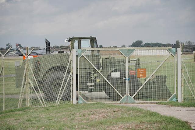 A military vehicle blocking a gate into an RAF base