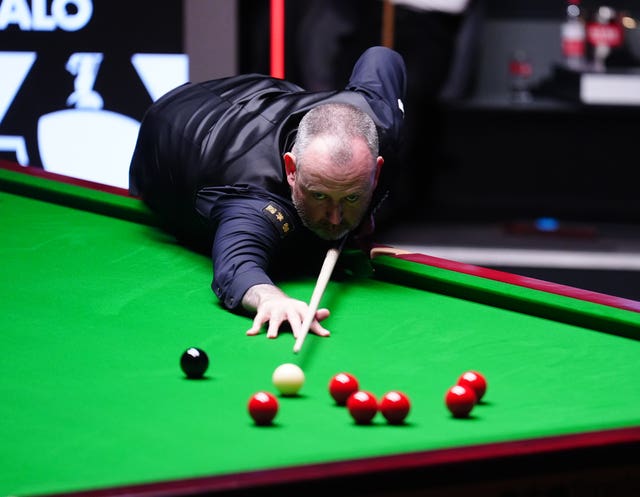 Mark Williams during his match with Zhao Xintong on day sixteen of the Halo World Snooker Championship at the Crucible Theatre.