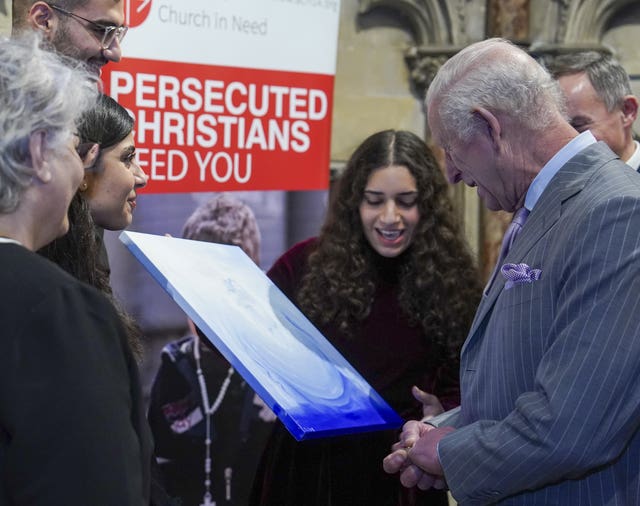 The King is presented with a painting by Sofia Butrus