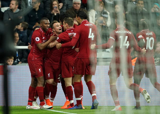 Liverpool players celebrate after Divock Origi''s winner 