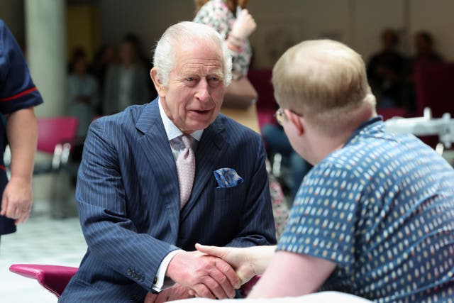 The King meeting with patient Jasper Keech during a visit to University College Hospital Macmillan Cancer Centre in April 2024