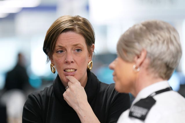 Jess Phillips speaks to a police officer