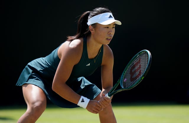 Mimi Xu prepares to return serve