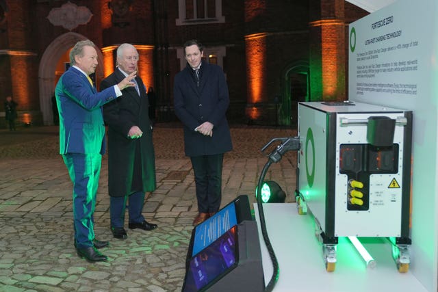 The King looking at a charging station with Andrew Forrest, of Fortescue 