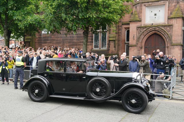 Olivia Henson arrives in a vintage car for her wedding to Hugh Grosvenor, the Duke of Westminster at Chester Cathedral 