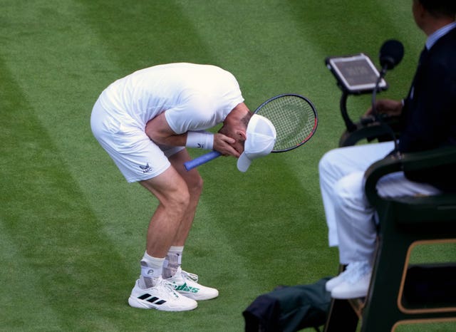 Andy Murray reacts to losing a point during his defeat to big-serving American John Isner