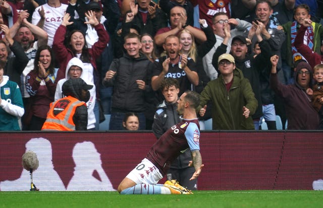 Danny Ings slides on his knees after scoring for new club Aston Villa