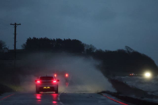 Cars driving through flooded roads 