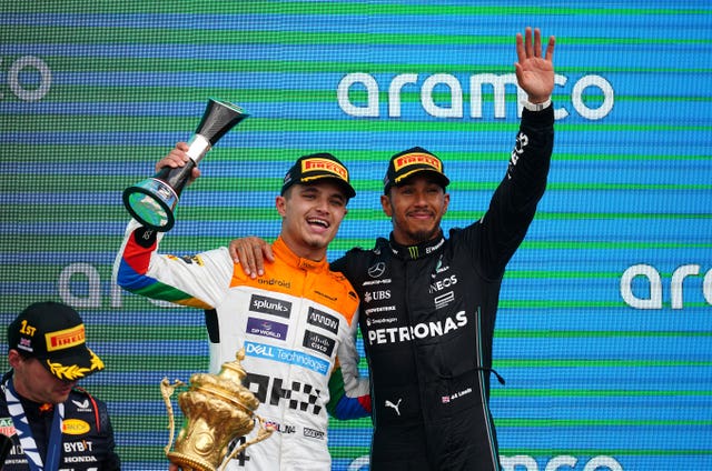 Lando Norris, left, and Lewis Hamilton on the podium after the 2023 British Grand Prix