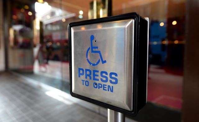 A disabled entrance door button (Andrew Matthews/PA) 