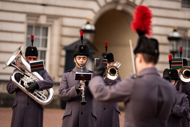 The Band and Bugles of The Rifles perform the hits on the Palace forecourt