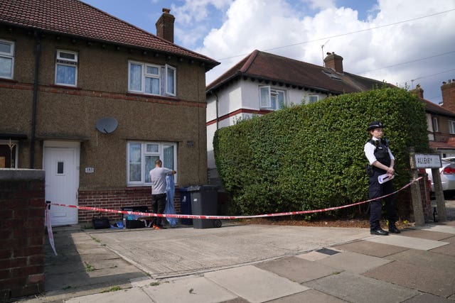 Police and forensic officers at a property in Southall, west London