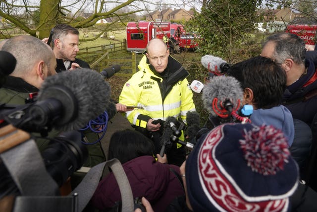 Peter Faulding (centre) CEO of private underwater search and recovery company Specialist Group International (SGI), speaks to the media in St Michael’s on Wyre, Lancashire, as police continue their search for missing woman Nicola Bulley