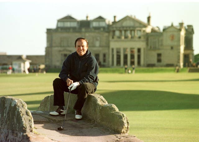 President Carlos Menem sits on Swilkem bridge before playing his second shot on the old course at St Andrews Royal & Ancient golf course (David Cheskin/PA)