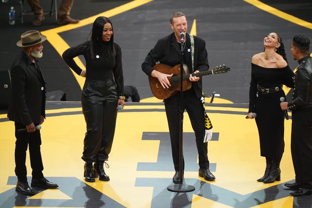 Chris Martin and members of the Universal Gospel Choir perform at the opening ceremony of the 2025 Invictus Games in Vancouver