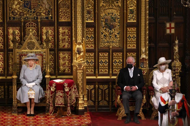 The Prince of Wales and the Duchess of Cornwall seated alongside the Queen in the House of Lords