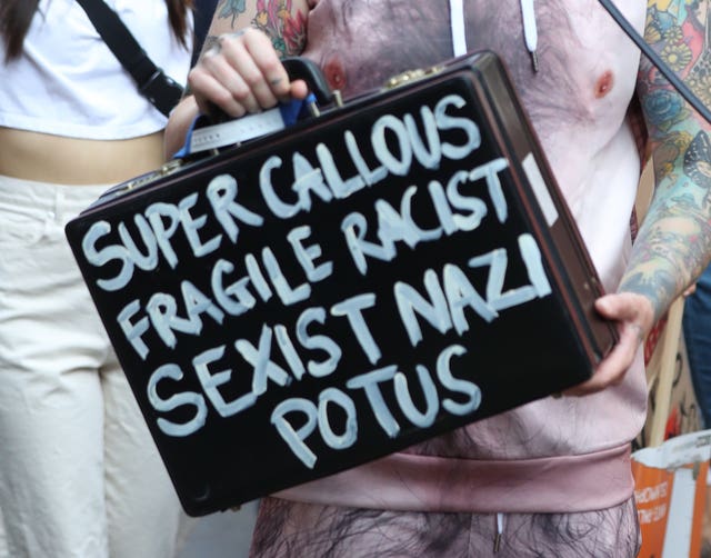 A protest sign during the Trump march
