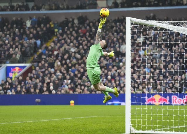 Everton goalkeeper Jordan Pickford makes a save from a shot from Aston Villa’s Morgan Rogers (not pictured)