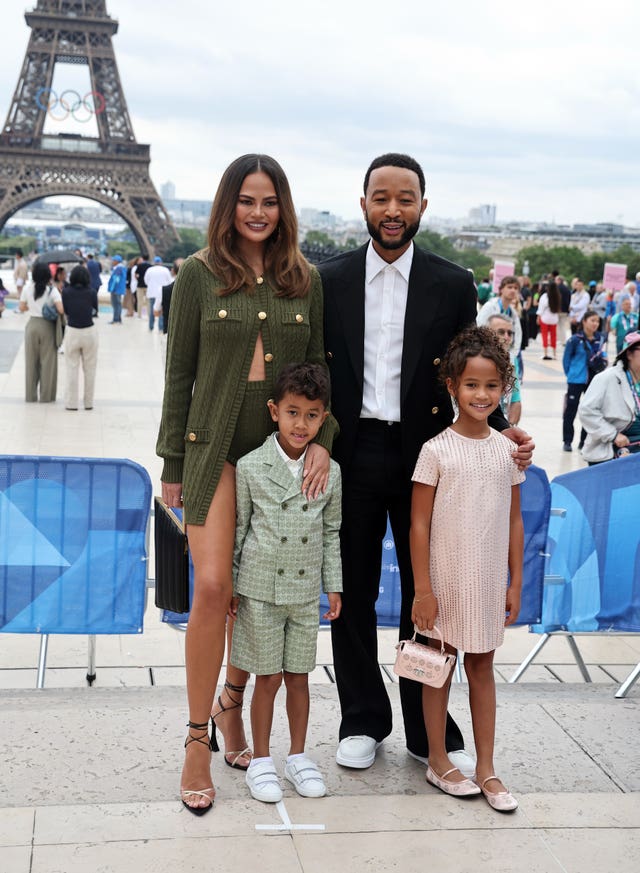 John Legend and Chrissy Teigen with children Luna and Miles near the  Eiffel Tower