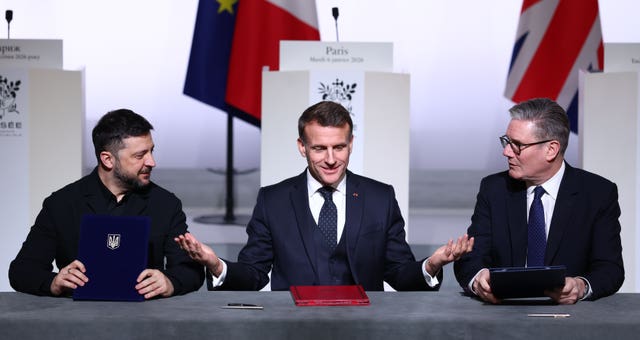 The three leaders sat behind a table 