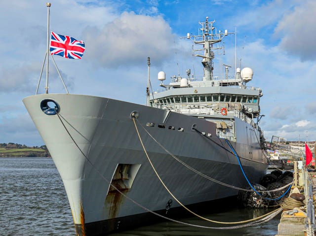 HMS Echo in Devonport Dockyard flying its flag at half mast in tribute to Captain Sir Tom Moore