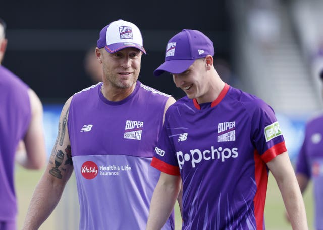 Andrew Flintoff, left, chats to Harry Brook