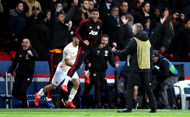 Solskjaer and his players celebrate their improbable win at the Parc des Princes