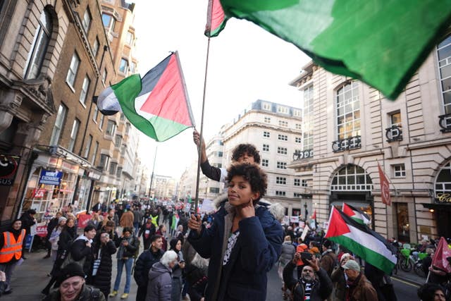 People take part in a Palestine Solidarity Campaign rally in central London 