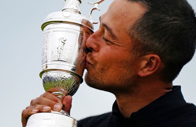 Xander Schauffele kisses the Claret Jug after his victory in the Open at Troon