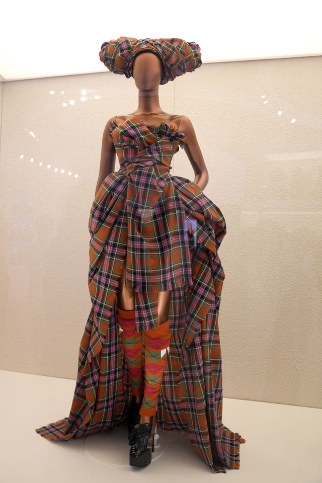 A tartan Vivienne Westwood dress worn by Naomi Campbell on display at the exhibition